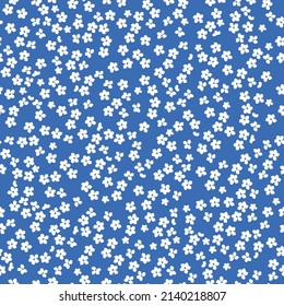 Seamless vintage pattern. small white flowers . blue background. vector texture. fashionable print for textiles, wallpaper and packaging.
