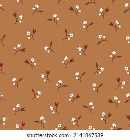 Seamless vintage pattern. small white flowers, brown leaves. terracotta background. vector texture. fashionable print for textiles, wallpaper and packaging.