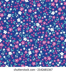 Seamless vintage pattern. small white and pink flowers, light blue leaves. Blue background. vector texture. fashionable print for textiles, wallpaper and packaging.