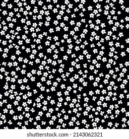 Seamless vintage pattern. small white flowers. black background. vector texture. fashionable print for textiles, wallpaper and packaging.