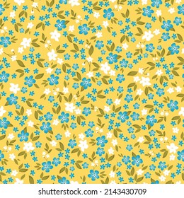 Seamless vintage pattern. Small white and blue flowers, mustard leaves. Yellow background. vector texture. fashionable print for textiles, wallpaper and packaging.
