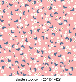 Seamless vintage pattern. Small white flowers, blue leaves. Light pink background. vector texture. fashionable print for textiles, wallpaper and packaging.