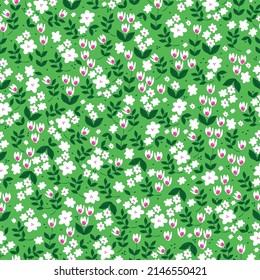 Nahtloses Vintage-Muster. Kleine weiße Blumen, grüne Blätter. Hellgrüner Hintergrund. Vektorstruktur. modischer Druck für Textilien, Tapeten und Verpackungen.