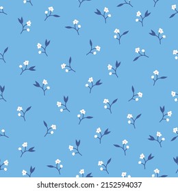 Seamless vintage pattern. Small white flowers, blue leaves. Light blue background. vector texture. fashionable print for textiles, wallpaper and packaging.