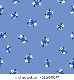 seamless vintage pattern. small white and blue flowers. blue  background. vector texture. fashionable print for textiles and wallpaper.