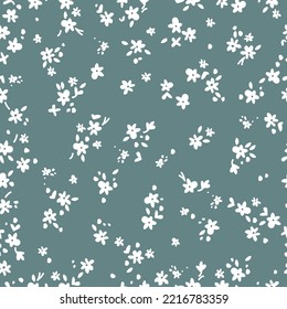 seamless vintage pattern. small white flowers and leaves. grey-blue  background. vector texture. fashionable print for textiles and wallpaper.