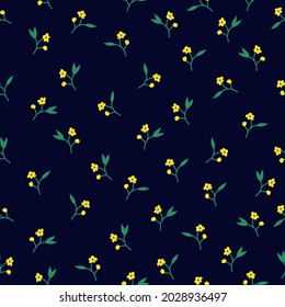 Seamless vintage pattern. small yellow flowers, green leaves on a dark blue background. vector texture. trend print for textiles.