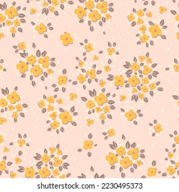 Seamless vintage pattern. Small yellow flowers on a light peach background. Vector texture. Fashionable print for textiles and wallpaper.