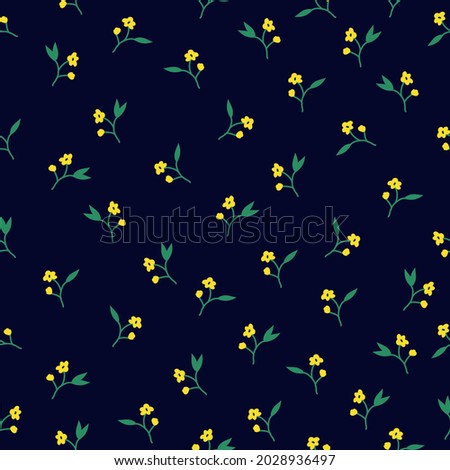 Seamless vintage pattern. small yellow flowers, green leaves on a dark blue background. vector texture. trend print for textiles.