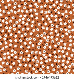 seamless vintage pattern . terracotta background, small white flowers . vector texture. trend print for textiles and wallpaper.