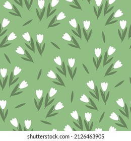 Seamless vintage pattern. Tulips have white flowers, green leaves. Light green background. vector texture. fashionable print for textiles, wallpaper and packaging.