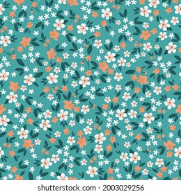 Seamless vintage pattern. turquoise background. small white and orange flowers. vector texture. a bright trend print for textiles and wallpaper.