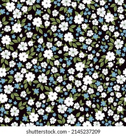 Patrón vintage sin foco. Flores blancas y azules, hojas verdes. Fondo negro. textura vectorial. impresión de moda para textiles, papel pintado y embalaje.