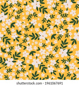Seamless vintage pattern. white flowers. dark green leaves. yellow background. trend print for surface printing and web design.