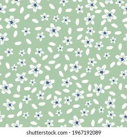Seamless vintage pattern. white flowers. white petals. pale green background. Vector texture. fashionable print for textiles and wallpaper.