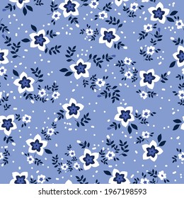 Seamless vintage pattern. white flowers. dark blue leaves. light blue background. Vector texture. fashionable print for textiles and wallpaper.