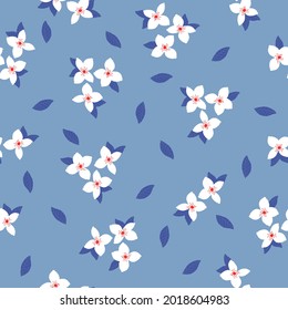 Seamless vintage pattern. white flowers, dark blue leaves on a light blue background. vector texture. trend print for textiles and wallpaper.

