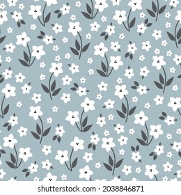 Seamless vintage pattern. white flowers, dark gray leaves. light blue-gray background. vector texture. bright trend print for textiles.