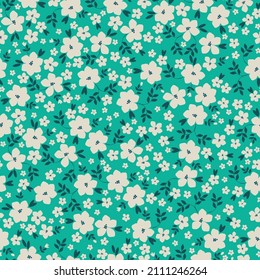 Seamless vintage pattern. White flowers, dark blue leaves. Bright turquoise background. vector texture. fashionable print for textiles, wallpaper and packaging.