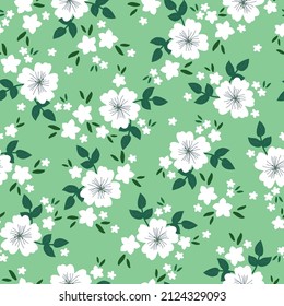 Seamless vintage pattern. White flowers and green leaves . Light green background. vector texture. fashionable print for textiles, wallpaper and packaging.