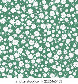 Patrón vintage sin foco. Flores y hojas blancas. fondo verde. textura vectorial. impresión de moda para textiles, papel pintado y embalaje.
