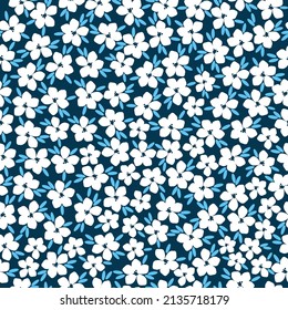 Seamless vintage pattern. white flowers, bright blue leaves. dark blue background. vector texture. fashionable print for textiles, wallpaper and packaging.
