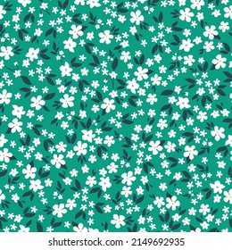 Seamless vintage pattern. White flowers, dark green leaves. Green background. vector texture. fashionable print for textiles, wallpaper and packaging.