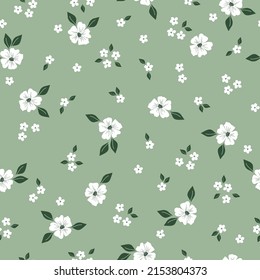 Seamless vintage pattern. White flowers, green leaves. Light green background. vector texture. fashionable print for textiles, wallpaper and packaging.