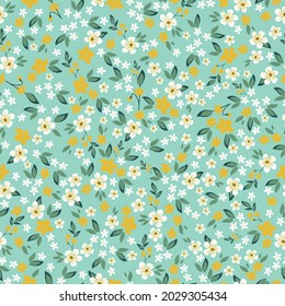 Seamless vintage pattern . white and yellow flowers , green leaves on a light green background. vector texture. An elegant template for fashionable prints.