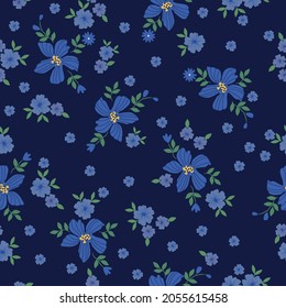 Seamless vintage pattern. Wonderful blue flowers and green leaves on a dark blue background. vector texture. trend print for textiles, wallpaper and packaging.