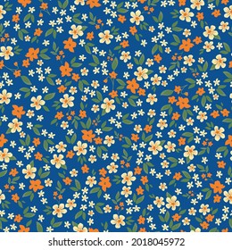 Patrón vintage sin foco. flores maravillosas naranjas y lechosas, hojas verdes. fondo azul brillante. textura vectorial. impresión de tendencia para textiles y papel pintado.