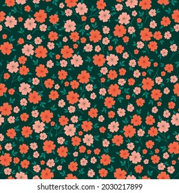 Seamless vintage pattern. wonderful orange and coral flowers and green leaves on a dark green background. vector texture. trend print for textiles.
