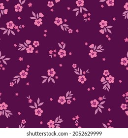 Seamless vintage pattern. wonderful pink flowers and leaves on a burgundy background. vector texture. trend print for textiles, wallpaper and packaging.