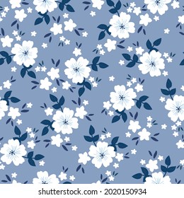 Seamless vintage pattern. wonderful white flowers, dark blue leaves on a light blue background. vector texture. trend print for textiles and wallpaper.
