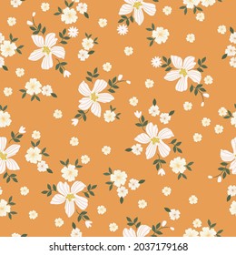 Seamless vintage pattern. Wonderful white flowers ,green leaves on an orange background. vector texture. trend print for textiles and wallpaper.