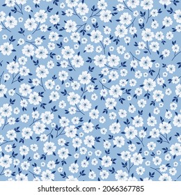 Seamless vintage pattern. wonderful white flowers and blue leaves on a light blue background. vector texture. fashionable print for textiles, wallpaper and packaging.