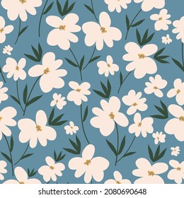 Seamless vintage pattern. Wonderful white flowers and green leaves on a blue background. vector texture. Fashionable print for textiles and wallpaper.