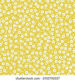Seamless vintage pattern. yellow background ,small white flowers . vector texture. trend print for textiles and wallpaper.
