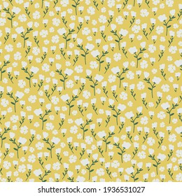 Seamless vintage pattern. yellow background. small white flowers. vector texture. trend print for textiles and wallpaper.