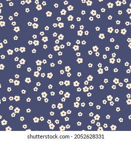 Seamless vintage pattern.small white flowers on a dark blue background. vector texture. trend print for textiles, wallpaper and packaging.