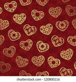 Seamless wallpaper with gold hearts on a red background