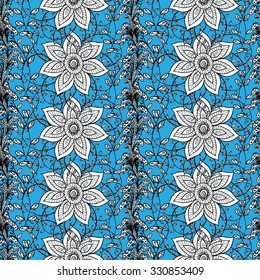 Seamless wallpaper pattern in vintage style on light blue background. 