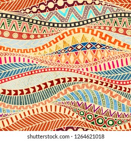 Seamless wavy pattern. Ethnic and tribal motifs. Colorful african print for textiles. Grunge texture. Ornate ornament drawn by hand.