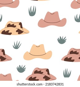 Seamless western pattern with cowboy hats and grass. Vector wild west background