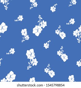 seamless white flower pattern on blue backround. Vintage floral pattern great for fashion fabric print. 