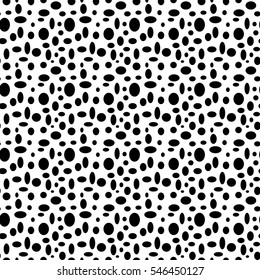 Seamless white pattern with black polka dots in different sizes as a background - Eps10 vector graphics and illustration