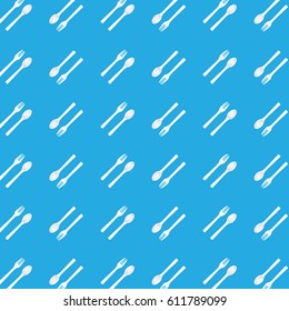 Seamless white spoon and fork pattern on blue background.
