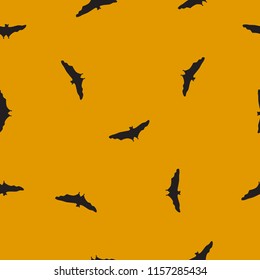 Seamless wild animals pattern Bats black silhouette on yellow background. Halloween drawn simple texture with flying spooky vampire, funny kids print for fabric clothes, scrapbooking, vector eps 10