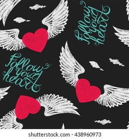 Seamless with winged hearts on a black background "Follow your heart"