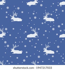 Seamless winter animal pattern with silhouetted elk or deer and snowflakes. Cute seasonal Christmas design.